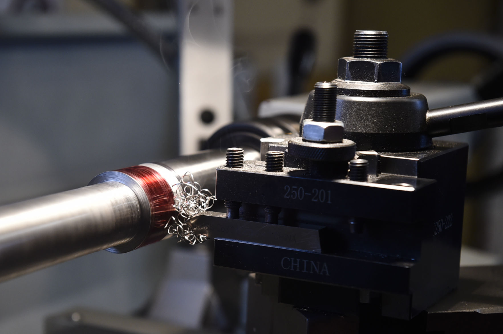 McLaughlin shapes a barrel blank on a lathe.